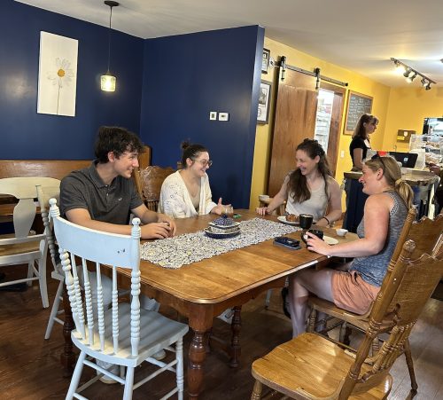 Summer Fellow Alec with ANCA staff at downtown bakery