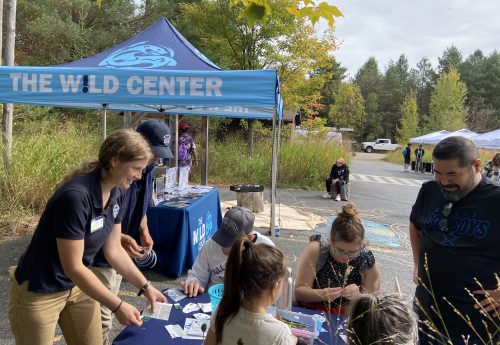 Visitors learn about electric vehicles at the 2024 North Country Drive Electric event at The Wild Center.