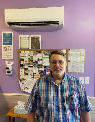 Raymond Higby of Complete Care Chiropractic in Lowville, New York with a newly installed heat pump